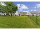 Well manicured and spacious fenced backyard with grill, lawn and patio at 1313 Kenwood Dr, Greenwood, IN 46143
