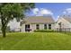 Backyard with patio, grill, lawn and fencing at 1313 Kenwood Dr, Greenwood, IN 46143