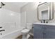 Updated bathroom featuring a shower-tub combo, modern vanity, and neutral tones at 1313 Kenwood Dr, Greenwood, IN 46143