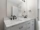 Bathroom features a double vanity with modern black fixtures and a large mirror at 1313 Kenwood Dr, Greenwood, IN 46143