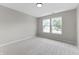 Bedroom filled with natural light from windows showcasing a neighborhood view at 1313 Kenwood Dr, Greenwood, IN 46143
