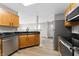 Kitchen featuring stainless steel appliances, granite countertops, and wooden cabinets at 1313 Kenwood Dr, Greenwood, IN 46143