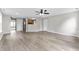 Open-concept living room featuring hardwood floors, a ceiling fan, and access to the kitchen at 1313 Kenwood Dr, Greenwood, IN 46143
