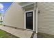 Side entrance featuring a black door with window panes and siding at 1313 Kenwood Dr, Greenwood, IN 46143