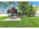 A lovely backyard with a well-manicured lawn, a paver patio, and mature trees at 13766 Heatherfield Dr, Fishers, IN 46038