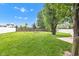 Spacious backyard with lush lawn, privacy fence and mature shade trees at 13766 Heatherfield Dr, Fishers, IN 46038