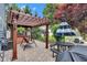 Beautiful backyard with paver patio, hot tub, pergola, and table with umbrella at 13766 Heatherfield Dr, Fishers, IN 46038