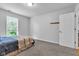 Bright bedroom with window view, neutral walls, carpeted floor, and a neatly made bed at 13766 Heatherfield Dr, Fishers, IN 46038