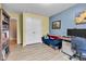 Cozy bedroom with a comfortable blue futon, natural light, and a dedicated workspace with dual monitors at 13766 Heatherfield Dr, Fishers, IN 46038