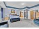 Large main bedroom suite features neutral paint, carpet, a tray ceiling and a seating area at 13766 Heatherfield Dr, Fishers, IN 46038