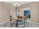 Cozy dining room with a round table, four chairs, and neutral paint color at 13766 Heatherfield Dr, Fishers, IN 46038