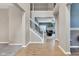 Spacious foyer with hardwood floors, a staircase, and an open view to the living room at 13766 Heatherfield Dr, Fishers, IN 46038