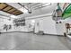 A spacious garage with epoxy floors and ample storage at 13766 Heatherfield Dr, Fishers, IN 46038