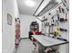 Well-organized garage with ample storage, work bench, and pegboard organizers at 13766 Heatherfield Dr, Fishers, IN 46038