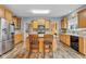 Kitchen features light wooden cabinetry, an island with seating and stainless steel appliances at 13766 Heatherfield Dr, Fishers, IN 46038