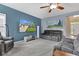 Inviting living room with a large TV, plush seating, and bright windows at 13766 Heatherfield Dr, Fishers, IN 46038