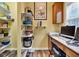 Pantry/office area featuring built-in shelving and plenty of counter space at 13766 Heatherfield Dr, Fishers, IN 46038