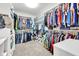 Spacious walk-in closet with custom shelving, racks, and ample storage space for an extensive wardrobe at 13766 Heatherfield Dr, Fishers, IN 46038