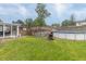 Spacious backyard featuring a pool, deck, patio, sunroom and mature trees at 1514 Bittersweet Dr, Greenfield, IN 46140