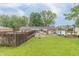 Backyard featuring a sunroom, deck, pool, and an outdoor seating area, perfect for entertaining at 1514 Bittersweet Dr, Greenfield, IN 46140
