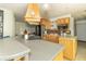 Well-equipped kitchen featuring wooden cabinets, an island with seating, and modern appliances at 1514 Bittersweet Dr, Greenfield, IN 46140