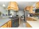 Spacious kitchen boasting a gas range, granite countertops, and stainless-steel appliances at 1514 Bittersweet Dr, Greenfield, IN 46140