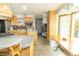 Open kitchen with ample cabinetry, a stainless-steel refrigerator, and a cozy breakfast nook at 1514 Bittersweet Dr, Greenfield, IN 46140