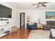 Cozy living room with hardwood floors and a comfortable seating arrangement at 1514 Bittersweet Dr, Greenfield, IN 46140
