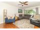 Comfortable living room with hardwood floors, large windows, and stylish furnishings at 1514 Bittersweet Dr, Greenfield, IN 46140
