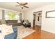 Bright and airy living room with hardwood floors and comfortable seating at 1514 Bittersweet Dr, Greenfield, IN 46140