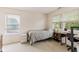 Bright bedroom with neutral walls and carpet, and a twin bed with two windows at 15409 Heath Cir, Westfield, IN 46074