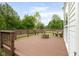Spacious wooden deck featuring a cozy fire pit and built-in bench seating perfect for outdoor entertaining at 15409 Heath Cir, Westfield, IN 46074