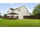 Exterior view of the home showcasing a spacious backyard, deck with gazebo, and well-maintained lawn at 15409 Heath Cir, Westfield, IN 46074