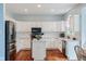 Bright kitchen featuring white cabinetry, modern appliances, and a functional center island at 15409 Heath Cir, Westfield, IN 46074
