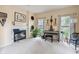 Spacious living room featuring a fireplace, guitars, and plenty of natural light at 15409 Heath Cir, Westfield, IN 46074