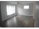 Bright living room featuring hardwood floors, ceiling fan and ample natural light at , Indianapolis, IN 46218