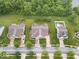 Lovely aerial view of a home with great curb appeal including manicured lawn, landscaping, and hardscaped driveway at 1905 Persimmon Grove Dr, Indianapolis, IN 46234