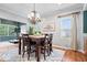 Bright dining area showcasing a dining table set and a modern chandelier at 1905 Persimmon Grove Dr, Indianapolis, IN 46234