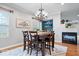 Cozy dining area featuring a dining table, chandelier, and fireplace at 1905 Persimmon Grove Dr, Indianapolis, IN 46234