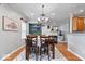Elegant dining area with decorative lighting, fireplace and convenient access to the kitchen at 1905 Persimmon Grove Dr, Indianapolis, IN 46234