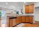 Well-appointed kitchen featuring stainless steel appliances and warm wood cabinets at 1905 Persimmon Grove Dr, Indianapolis, IN 46234