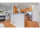 Open kitchen layout with stainless appliances and warm wood cabinets at 1905 Persimmon Grove Dr, Indianapolis, IN 46234