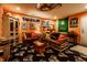 Cozy basement featuring two sofas and a cabinet, adorned with Purdue University-themed decor and accents at 2017 Rhettsbury St, Carmel, IN 46032