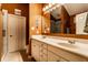 Bathroom featuring a double sink vanity, large mirror, and a glass enclosed shower at 2017 Rhettsbury St, Carmel, IN 46032