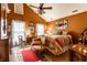 Cozy bedroom with vaulted ceilings, ceiling fan, colorful bedding and rug, and desk near the windows at 2017 Rhettsbury St, Carmel, IN 46032