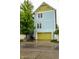Two-story home featuring a green garage door and blue siding with bright-colored exterior at 2017 Rhettsbury St, Carmel, IN 46032