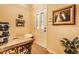 Inviting foyer with a decorative table, hardwood floors, and a white door, enhanced by neutral-toned walls at 2017 Rhettsbury St, Carmel, IN 46032