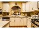 Bright kitchen with stainless appliances, tile counters, light cabinetry, and a convenient layout for cooking at 2017 Rhettsbury St, Carmel, IN 46032