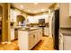 Functional kitchen features a central island, plenty of storage, stainless steel appliances, and tile countertops at 2017 Rhettsbury St, Carmel, IN 46032