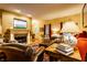 Inviting living room with fireplace, TV, plush seating, and stylish decor creating a comfortable atmosphere at 2017 Rhettsbury St, Carmel, IN 46032